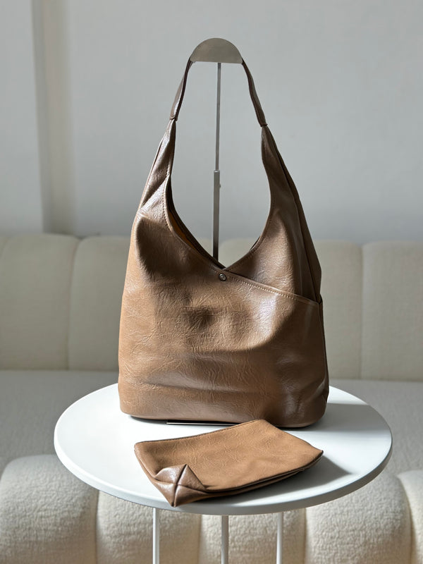 حقيبة جلدية مع جزدان إضافي